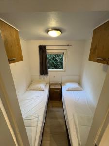 Postel nebo postele na pokoji v ubytování Chalet Hoenderloo + 9 fotografií