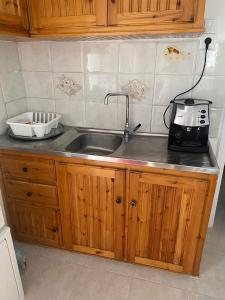 A kitchen or kitchenette at Aggeliki Homes paradosiako nisiotiko