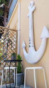 a anchor sign on the side of a building at ZOIS APARTMENT in Artemida