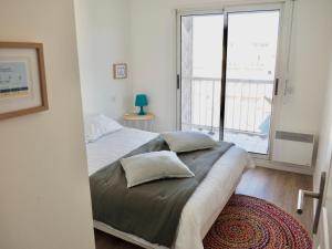 Кровать или кровати в номере Appart T4 lumineux avec terrasse vue mer