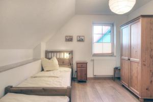 a bedroom with two beds and a window at Edda in Zingst