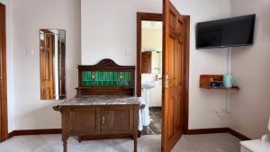 a bathroom with a sink and a mirror at Lurgan House in Westport