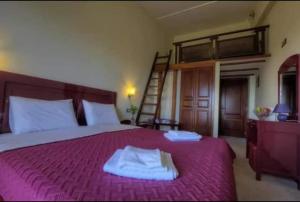 Postel nebo postele na pokoji v ubytování Hotel Isaraiko Spiti Agia Theodora