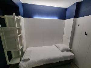 Ένα ή περισσότερα κρεβάτια σε δωμάτιο στο Hotel HEB