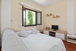 Postel nebo postele na pokoji v ubytování Villa Lianolia
