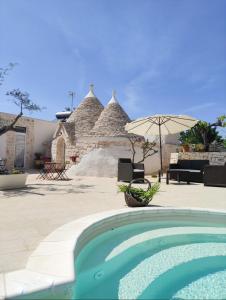 Bazén v ubytování Trulli bella vite nebo v jeho okolí