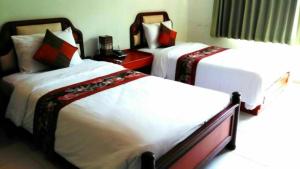 Voodi või voodid majutusasutuse Chaweng Tara Hotel toas