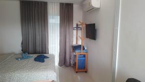 Postel nebo postele na pokoji v ubytování Mantra condo by malai