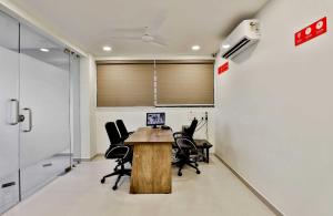 an office with a conference room with a table and chairs at Collection O 12462 Hotel Shiv Inn in Adalaj