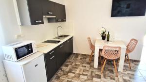 Kuchyňa alebo kuchynka v ubytovaní Apartments Brajde