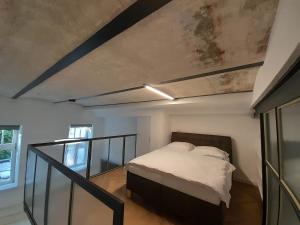 Postel nebo postele na pokoji v ubytování Entrez Apartments Baštová - City centre