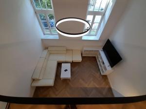 an overhead view of a living room with a round mirror at Entrez Apartments 4 - City centre in Košice