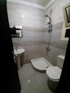 a bathroom with a toilet and a sink and a tub at قريه لاسرينا العين السخنة in Ain Sokhna