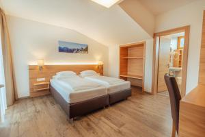 Postel nebo postele na pokoji v ubytování Hotel Gesser