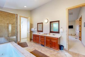 a bathroom with a tub and a sink and a shower at Heavenly Lake Hideaway in South Lake Tahoe +22 photos