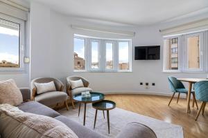 Televízia a/alebo spoločenská miestnosť v ubytovaní Atocha FreshApartments + 8 fotografií
