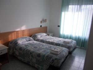 Postel nebo postele na pokoji v ubytování Scacco Rosso