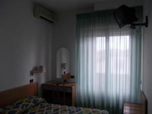 Postel nebo postele na pokoji v ubytování Scacco Rosso