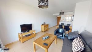 a living room with a couch and a tv at Casa Espliego A-Murcia Holiday Rentals Property in Torre-Pacheco