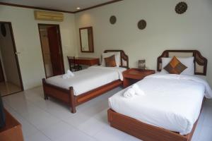 Voodi või voodid majutusasutuse Chaweng Tara Hotel toas