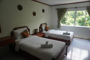 Voodi või voodid majutusasutuse Chaweng Tara Hotel toas