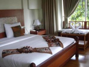 Voodi või voodid majutusasutuse Chaweng Tara Hotel toas