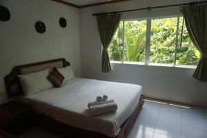 Voodi või voodid majutusasutuse Chaweng Tara Hotel toas
