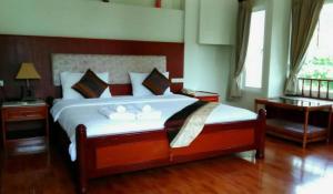Voodi või voodid majutusasutuse Chaweng Tara Hotel toas
