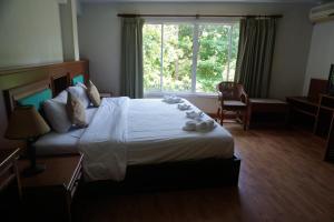 Voodi või voodid majutusasutuse Chaweng Tara Hotel toas