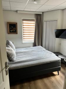 Postel nebo postele na pokoji v ubytování Hotel Workum