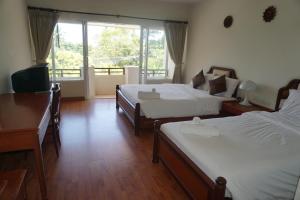 Voodi või voodid majutusasutuse Chaweng Tara Hotel toas