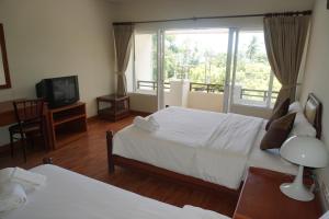 Voodi või voodid majutusasutuse Chaweng Tara Hotel toas