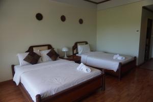 Voodi või voodid majutusasutuse Chaweng Tara Hotel toas