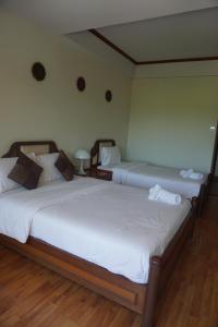 Voodi või voodid majutusasutuse Chaweng Tara Hotel toas