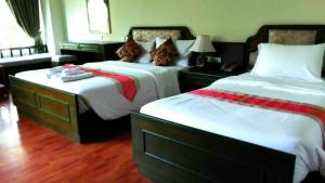 Voodi või voodid majutusasutuse Chaweng Tara Hotel toas