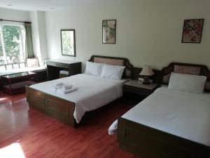 Voodi või voodid majutusasutuse Chaweng Tara Hotel toas