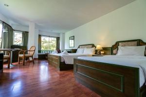 Voodi või voodid majutusasutuse Chaweng Tara Hotel toas