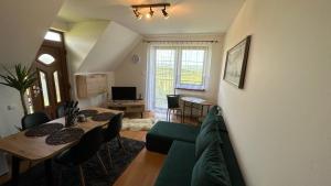 A television and/or entertainment centre at 2 room Apartment Nela, with a view of the mountains