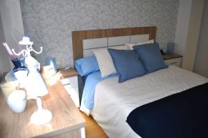 Łóżko lub łóżka w pokoju w obiekcie Apartamento Gran Torcal