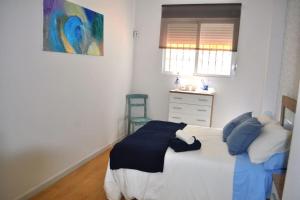 Łóżko lub łóżka w pokoju w obiekcie Apartamento Gran Torcal