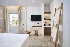 Voodi või voodid majutusasutuse Ubud Mykonos toas