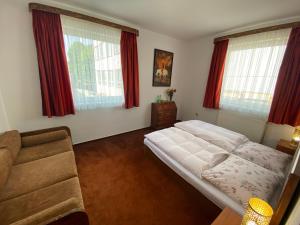 Postel nebo postele na pokoji v ubytování Penzión TATRA INN
