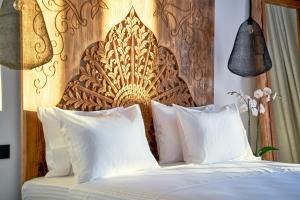Voodi või voodid majutusasutuse Ubud Mykonos toas