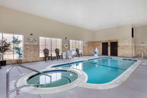 a large swimming pool in a hotel room at Comfort Inn & Suites Fort Worth - Fossil Creek in Fort Worth