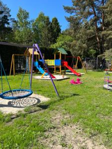 a group of playground equipment in a park at Baracuda in Dębki