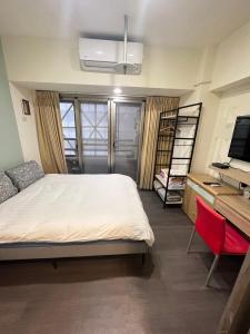 Postel nebo postele na pokoji v ubytování 果芒驛站旅店