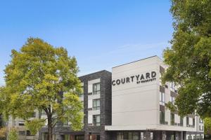 a rendering of a building with a court yard pharmacy at Courtyard by Marriott Seattle Northgate in Seattle