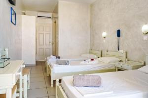 Postel nebo postele na pokoji v ubytování Sunrise Hotel
