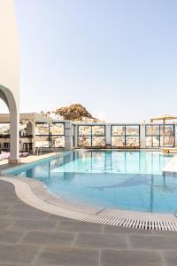 a large swimming pool on top of a building at Sunrise Hotel in Ios Chora