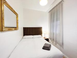 Postel nebo postele na pokoji v ubytování Casa Sagrada Familia